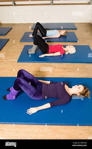 an-exercise-class-at-the-body-control-centre-in-london-practice-a-pilates-semi-supine-position-pilates-is-the-physical-fitness-system-developed-in-t-2BFF2GG