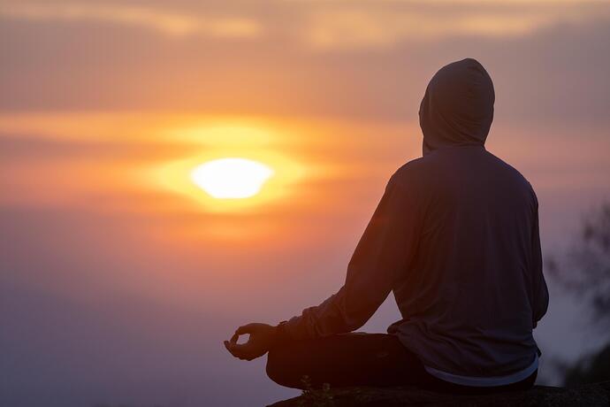 back-view-of-man-is-relaxingly-practicing-meditation-yoga-mudra-at-mountain-top-with-sunrise-in-winter-to-attain-happiness-from-inner-peace-wisdom-for-healthy-mind-and-soul-free-photo