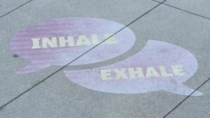 Street art depicting inhale and exhale