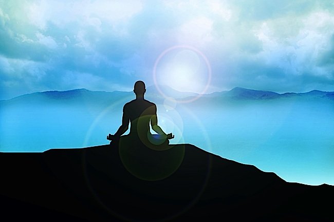 Buddha-Weekly-Lotus-position-meditation-mountain-top-misty-Buddhism